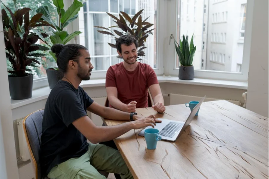 Two professionals implementing the best email marketing strategy for publishers to boost audience engagement through targeted campaigns
