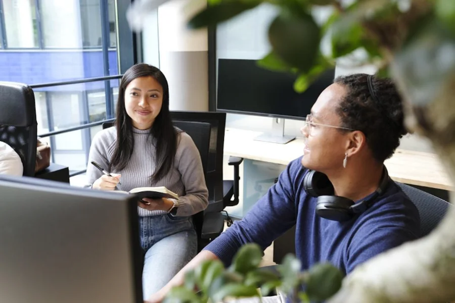 Employees optimizing revenue through subscriber monetization by implementing effective email marketing strategies for publishers